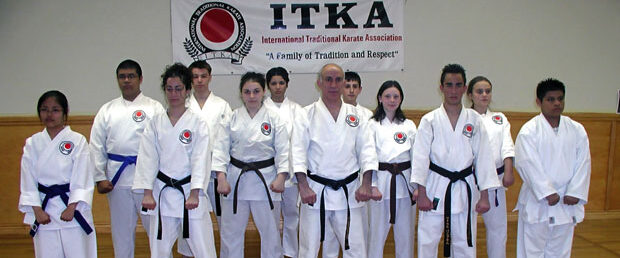 A group of people in white and black uniforms.