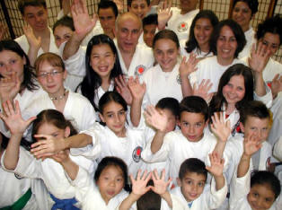 A group of people in white shirts and black ties.